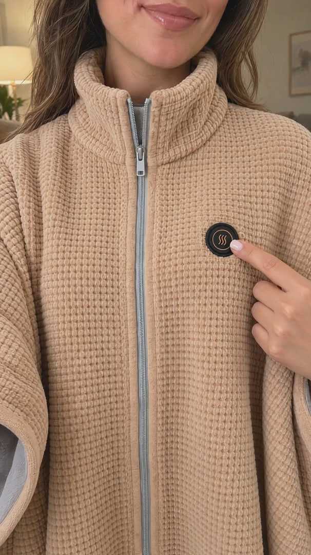 LYVRA Wärmeponcho: Powerbank anschließen, Heizknopf drücken und Wärmestufe wählen